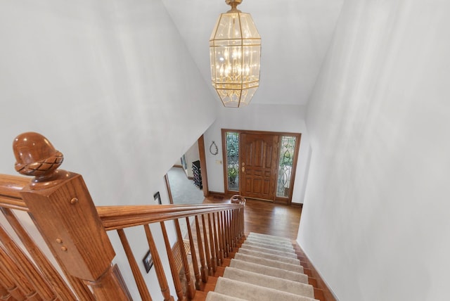 5232 Lola Way, Columbus, OH 43235 - entrance foyer featuring a chandelier, stairway, high vaulted ceiling, and wood finished floors