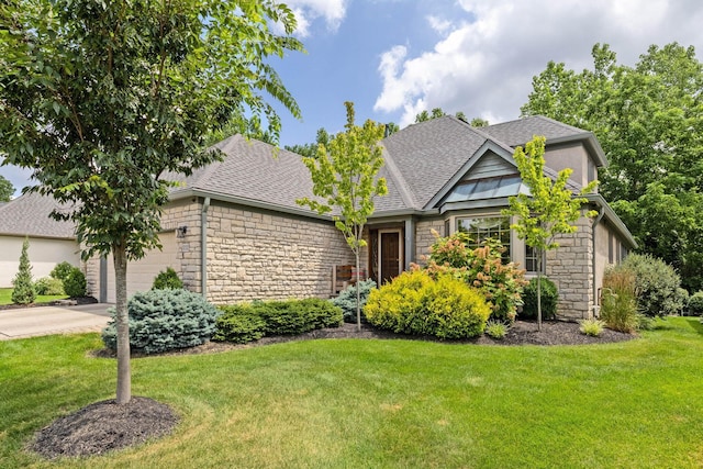 5232 Lola Way, Columbus, OH 43235 - view of front of property with stone siding, a shingled roof, and a front yard