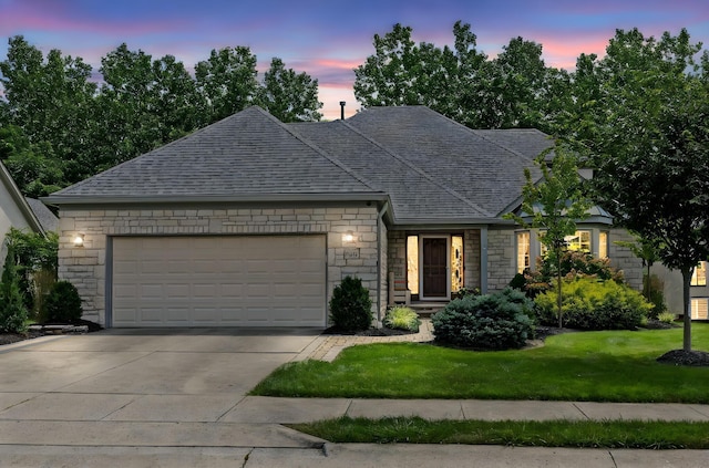 5232 Lola Way, Columbus, OH 43235 - view of front of house featuring stone siding, a garage, driveway, a front lawn, and roof with shingles