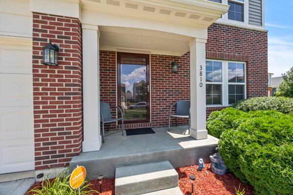 3810 Winding Path Dr, Canal Winchester, OH 43110 - view of exterior entry featuring brick siding and a porch
