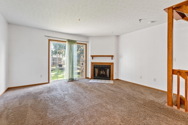 5692 Palos Ln Unit 168D, Hilliard, OH 43026 - unfurnished living room with carpet, a textured ceiling, and a fireplace with flush hearth