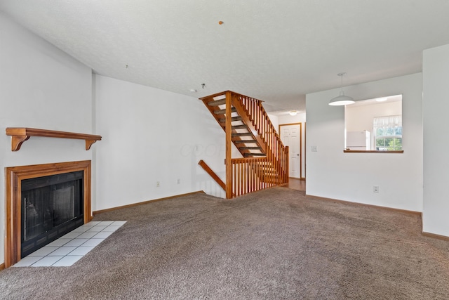 5692 Palos Ln Unit 168D, Hilliard, OH 43026 - unfurnished living room featuring carpet floors and a fireplace with flush hearth