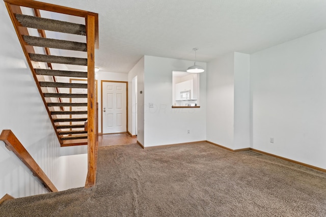 5692 Palos Ln Unit 168D, Hilliard, OH 43026 - staircase featuring carpet flooring and baseboards