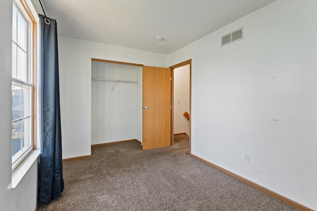 5692 Palos Ln Unit 168D, Hilliard, OH 43026 - unfurnished bedroom featuring carpet flooring and a closet