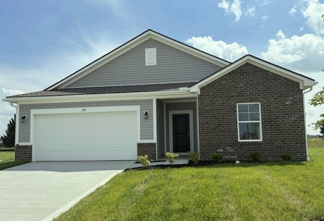 1199 Andrick Dr, Washington Court House, OH 43160 - view of front of house with brick siding, driveway, a front lawn, and an attached garage