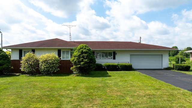 2052 Lorimer Dr NE, Newark, OH 43055 - ranch-style home with asphalt driveway, an attached garage, a front yard, and brick siding