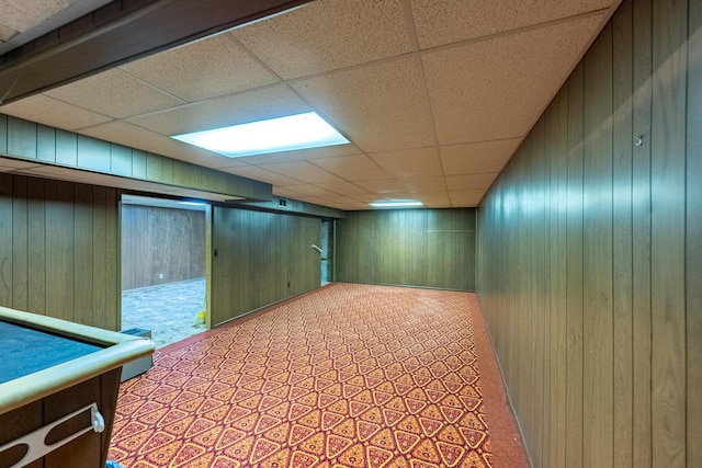 2052 Lorimer Dr NE, Newark, OH 43055 - finished basement featuring wood walls, a paneled ceiling, and carpet