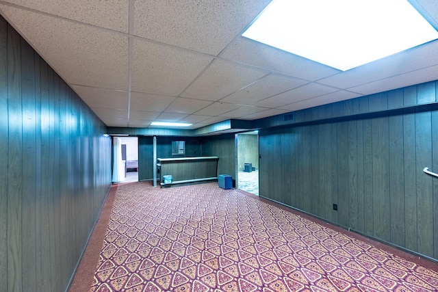 2052 Lorimer Dr NE, Newark, OH 43055 - finished below grade area featuring wooden walls, a drop ceiling, and carpet floors