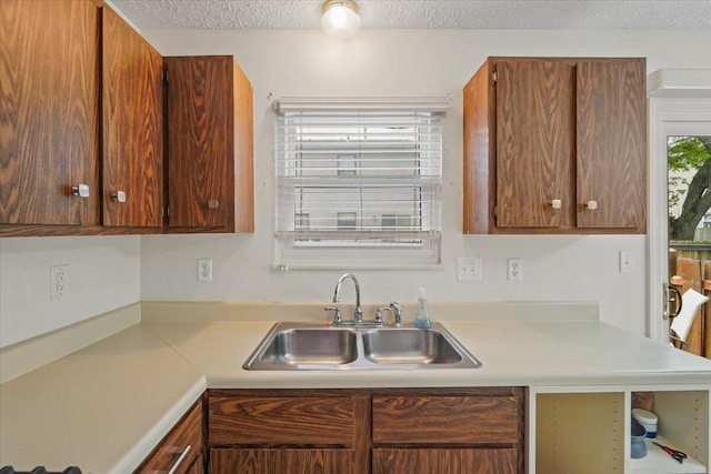 907 Soramill Ln Unit 8E, Columbus, OH 43085 - kitchen featuring light countertops and brown cabinetry