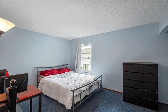 907 Soramill Ln Unit 8E, Columbus, OH 43085 - bedroom featuring dark carpet and a textured ceiling
