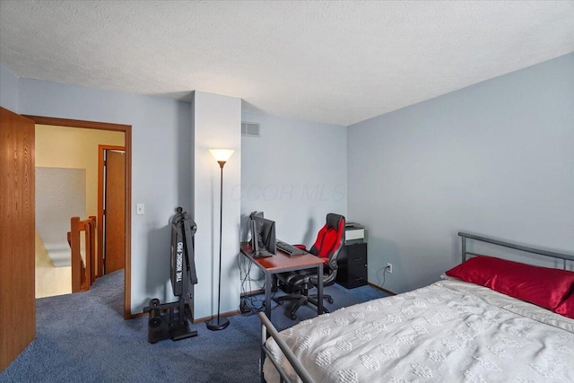 907 Soramill Ln Unit 8E, Columbus, OH 43085 - bedroom featuring carpet and a textured ceiling