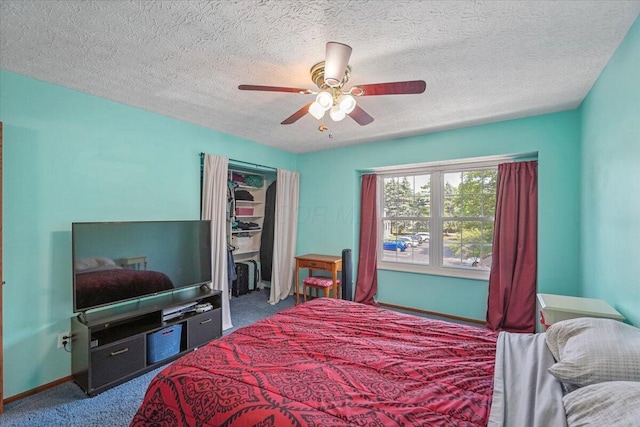 907 Soramill Ln Unit 8E, Columbus, OH 43085 - carpeted bedroom featuring a closet, a textured ceiling, and a ceiling fan
