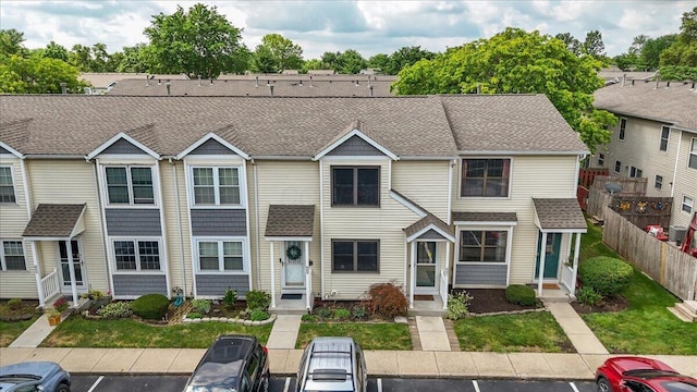 907 Soramill Ln Unit 8E, Columbus, OH 43085 - multi unit property with uncovered parking, entry steps, and roof with shingles