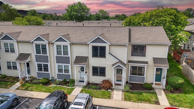 907 Soramill Ln Unit 8E, Columbus, OH 43085 - view of property with roof with shingles, uncovered parking, and entry steps