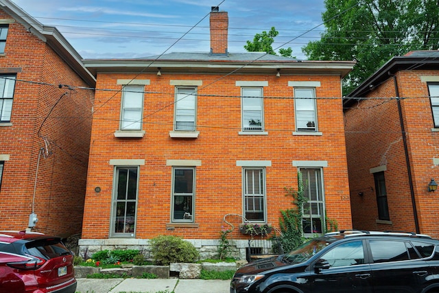 133 E Sycamore St, Columbus, OH 43206 - view of front of home featuring a chimney and brick siding