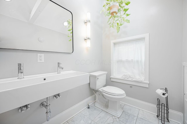 133 E Sycamore St, Columbus, OH 43206 - half bathroom featuring marble finish flooring and toilet