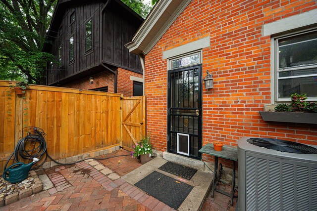 133 E Sycamore St, Columbus, OH 43206 - view of exterior entry featuring a gate and brick siding