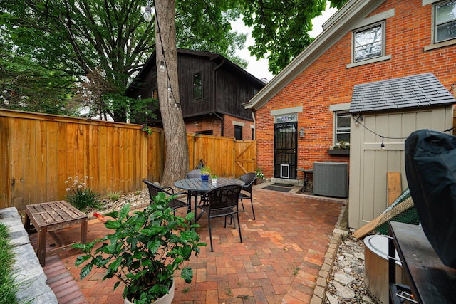 133 E Sycamore St, Columbus, OH 43206 - fenced backyard featuring a patio area, outdoor dining area, grilling area, and a gate
