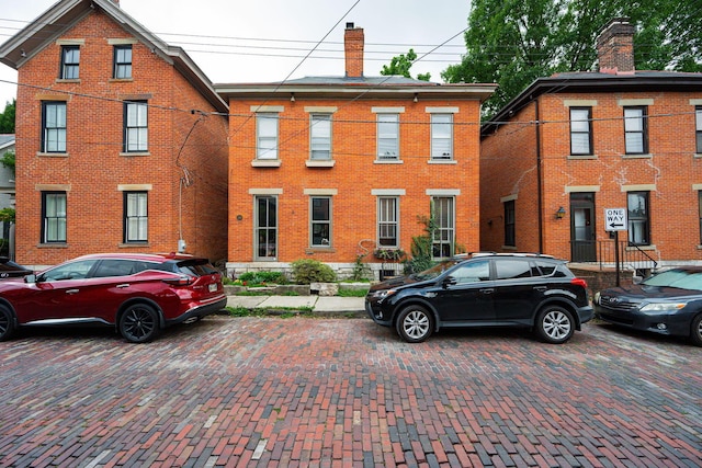 133 E Sycamore St, Columbus, OH 43206 - view of front facade featuring a chimney and brick siding