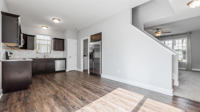 1968 Highbridge St, Newark, OH 43055 - kitchen featuring appliances with stainless steel finishes, a ceiling fan, dark brown cabinetry, and light countertops