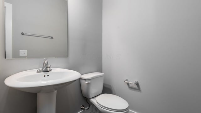 1968 Highbridge St, Newark, OH 43055 - half bathroom with toilet and baseboards