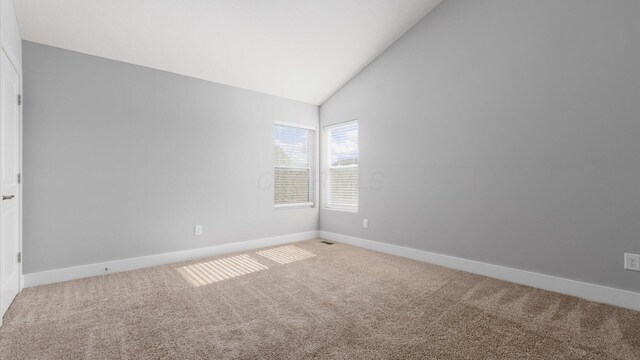 1968 Highbridge St, Newark, OH 43055 - carpeted spare room featuring baseboards and high vaulted ceiling