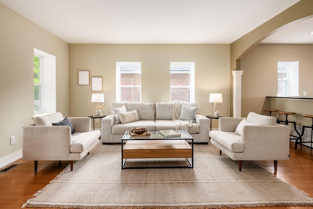 1293 Avondale Ave, Columbus, OH 43212 - living area featuring arched walkways and wood finished floors