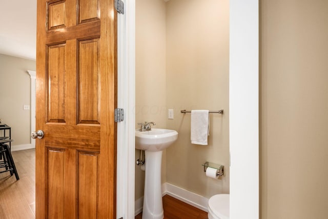 1293 Avondale Ave, Columbus, OH 43212 - half bathroom with toilet and wood finished floors