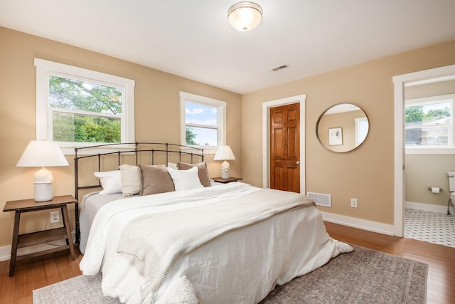 1293 Avondale Ave, Columbus, OH 43212 - bedroom featuring multiple windows and wood finished floors