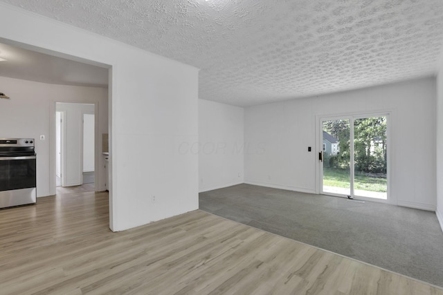 977 Sells Ave, Columbus, OH 43212 - spare room with wood finished floors and a textured ceiling