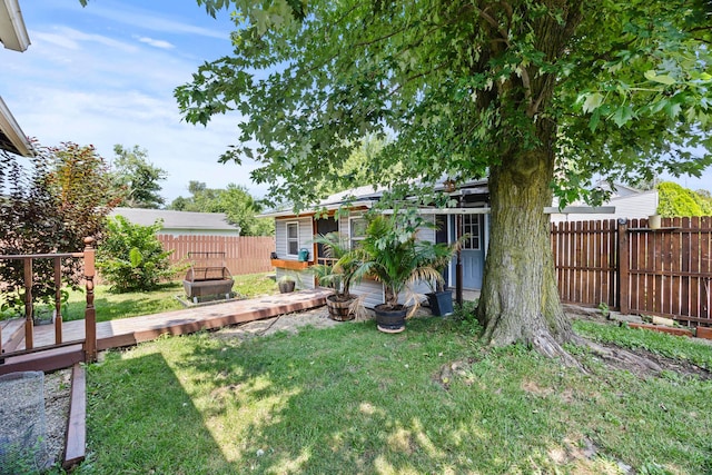 716 Uncapher Ave, Marion, OH 43302 - fenced backyard featuring a deck and an outbuilding