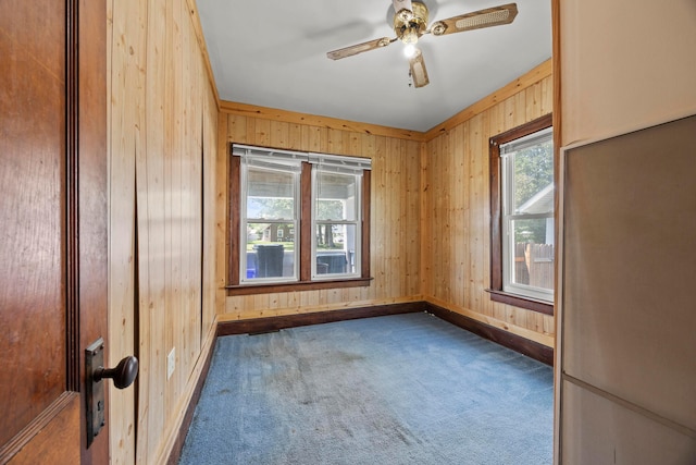716 Uncapher Ave, Marion, OH 43302 - unfurnished room featuring carpet flooring, wood walls, and ceiling fan