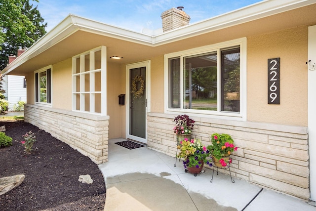 2269 Cranford Rd, Columbus, OH 43221 - doorway to property featuring a chimney and stucco siding