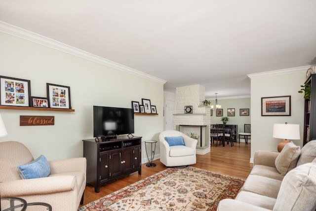 2269 Cranford Rd, Columbus, OH 43221 - living room featuring crown molding, wood finished floors, and a fireplace