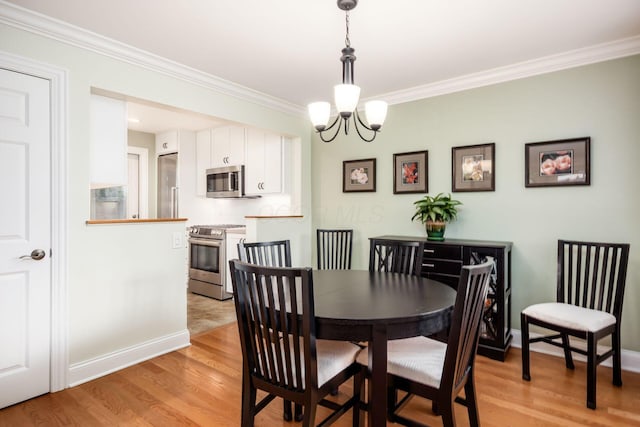 2269 Cranford Rd, Columbus, OH 43221 - dining space with ornamental molding, light wood-style floors, and a chandelier