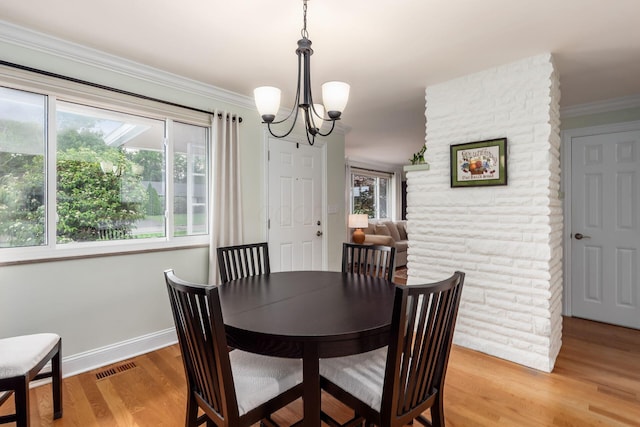 2269 Cranford Rd, Columbus, OH 43221 - dining space featuring a chandelier, light wood finished floors, and ornamental molding