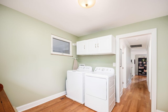 2269 Cranford Rd, Columbus, OH 43221 - laundry room with cabinet space, independent washer and dryer, and light wood-type flooring