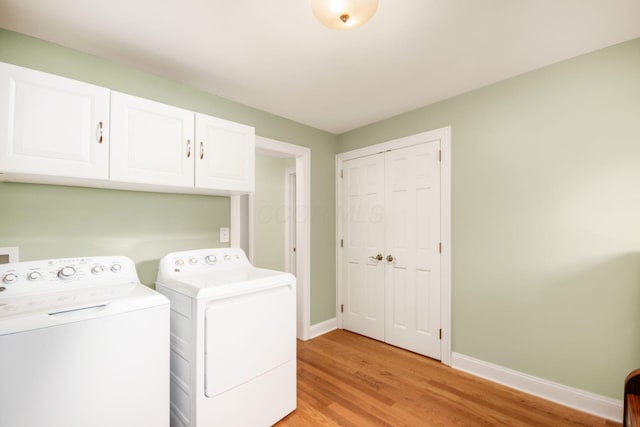 2269 Cranford Rd, Columbus, OH 43221 - laundry area featuring cabinet space, light wood-type flooring, and washing machine and clothes dryer
