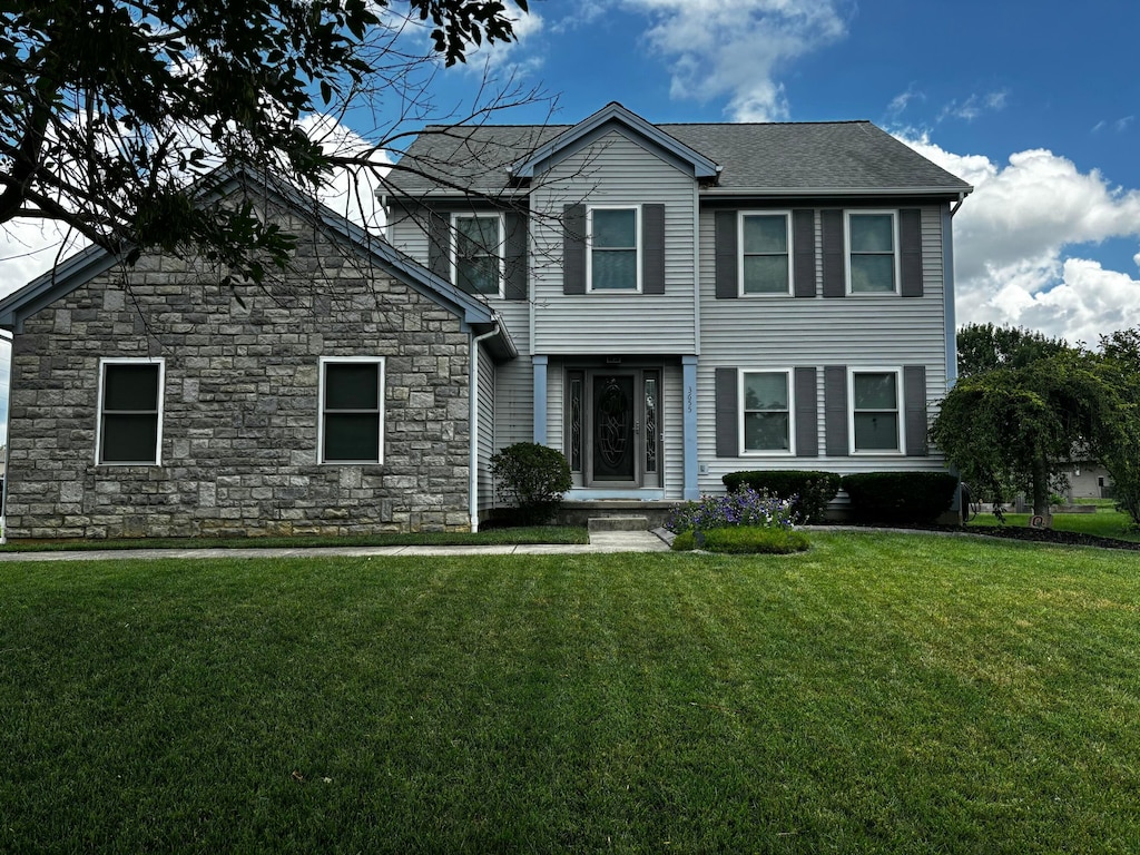 3655 Lake Albert Way, Grove City, OH 43123 - view of front of home with stone siding and a front yard
