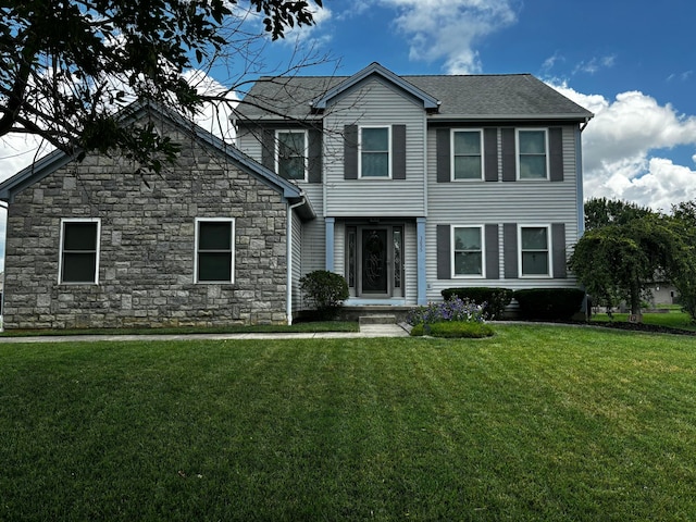 3655 Lake Albert Way, Grove City, OH 43123 - view of front of home with stone siding and a front yard