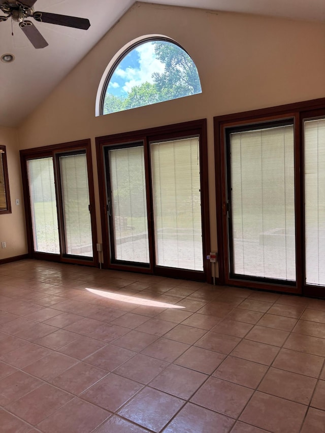 3535 Polley Rd, Columbus, OH 43221 - empty room with tile patterned floors, ceiling fan, and high vaulted ceiling