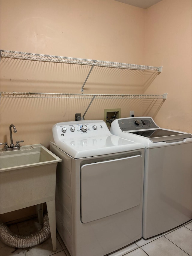 3535 Polley Rd, Columbus, OH 43221 - laundry area featuring washing machine and dryer and light tile patterned flooring