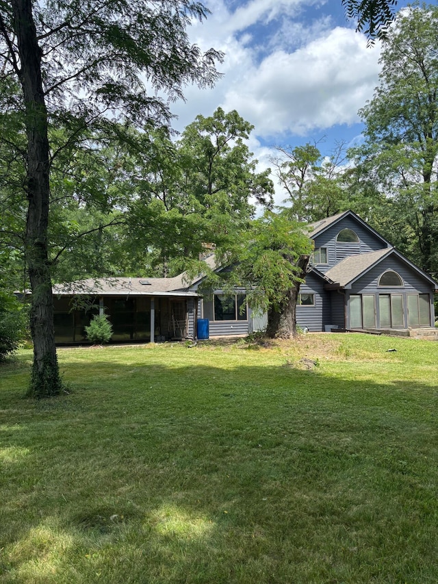 3535 Polley Rd, Columbus, OH 43221 - view of green lawn with a sunroom