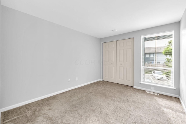 1030 Galliton Ct Unit B, Columbus, OH 43220 - unfurnished bedroom featuring carpet and a closet