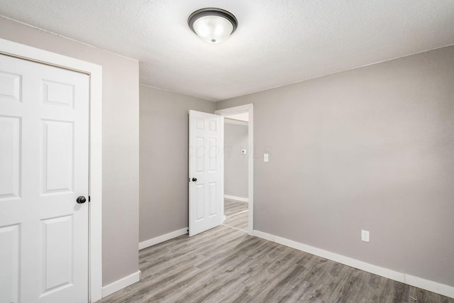 226 N Southampton Ave, Columbus, OH 43204 - unfurnished bedroom featuring wood finished floors and a textured ceiling