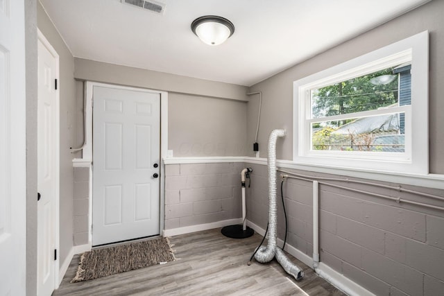 226 N Southampton Ave, Columbus, OH 43204 - washroom with concrete block wall and wood finished floors