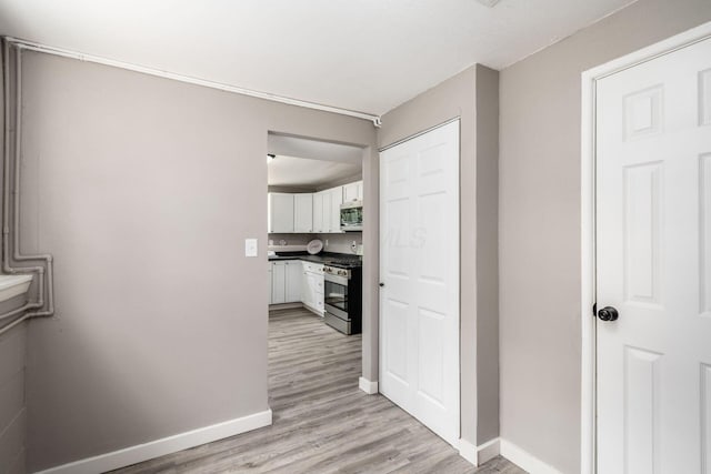 226 N Southampton Ave, Columbus, OH 43204 - hallway with light wood-style flooring and baseboards