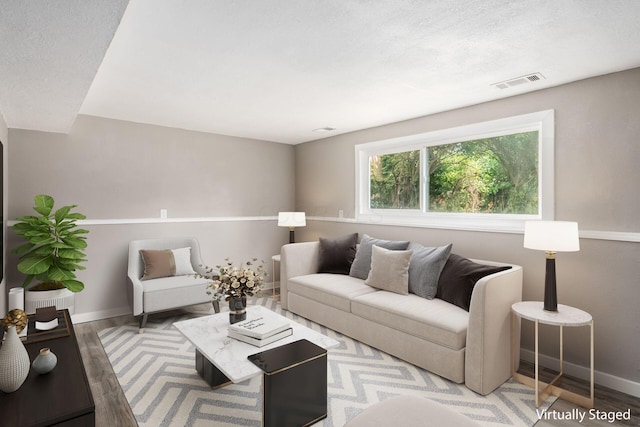 226 N Southampton Ave, Columbus, OH 43204 - living area with wood finished floors and a textured ceiling