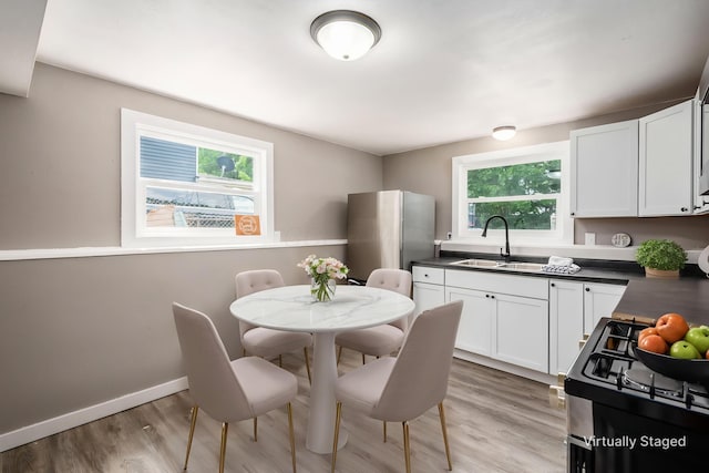 226 N Southampton Ave, Columbus, OH 43204 - dining room with light wood finished floors and baseboards