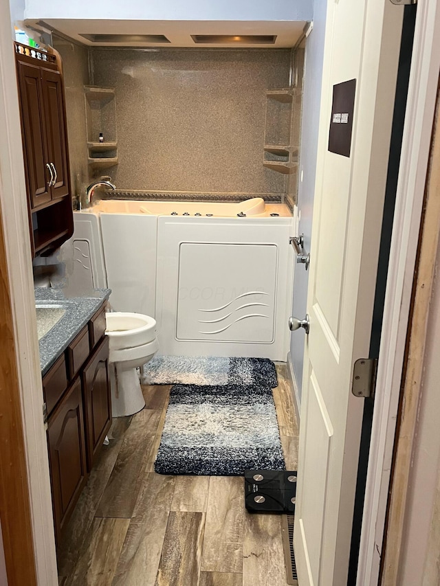 5254 Sedalia Dr, Columbus, OH 43232 - full bath featuring a tub to relax in, wood finished floors, and vanity